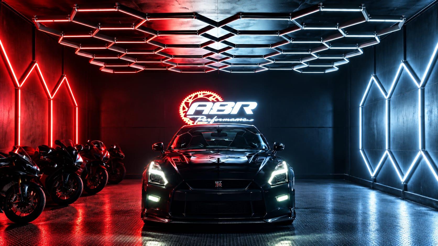 ASR Performance's unit: a black Nissan GT-R beneath hexagonal lighting, with a row of sports motorcycles alongside and the illuminated ASR Performance sign on the wall behind.